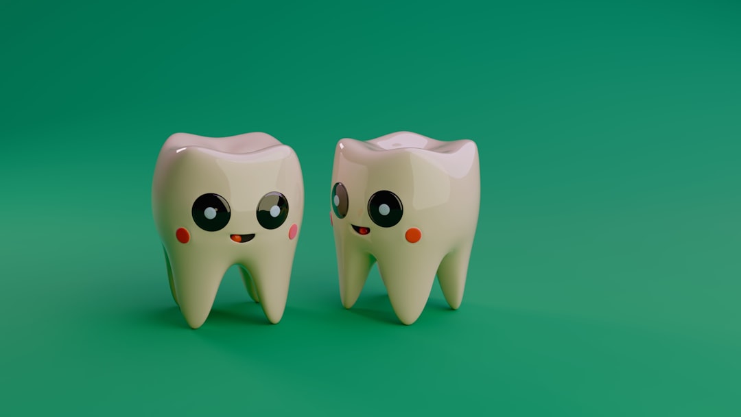 two-cartoon-teeth-smiling-on-a-green-background-2xs8xruhhn8